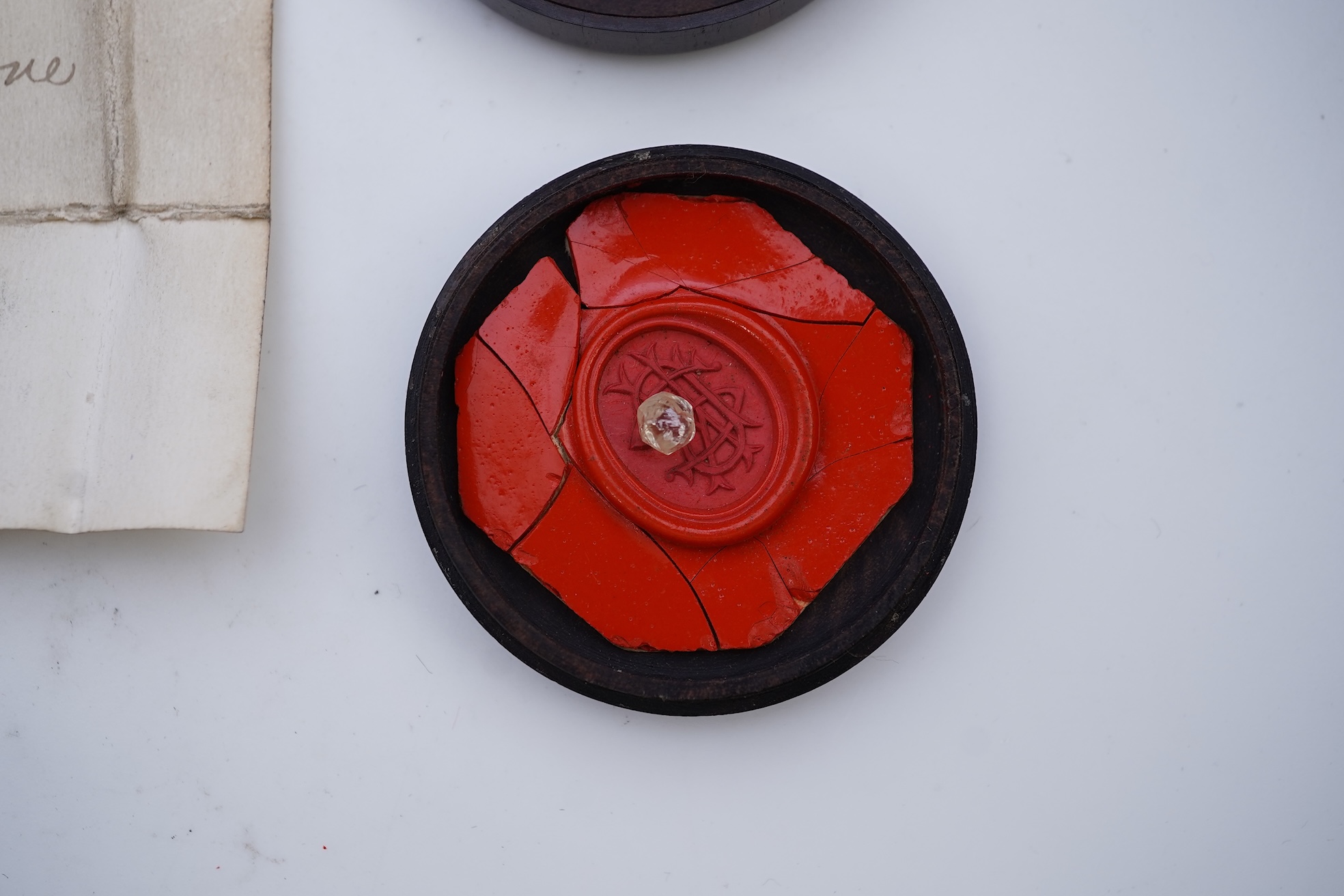 A rough diamond, with accompanying box and note, late 19th century